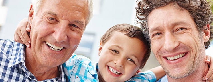 Son, father, and grandfather smiling