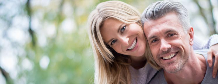 a middle-aged couple smiling