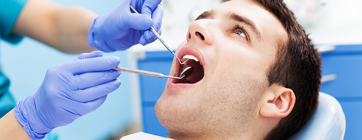 man recieving dental exam