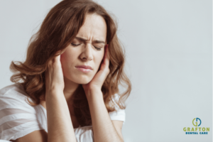 Woman with jaw pain