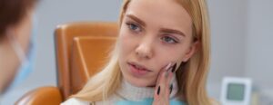 woman at dentist for dental emergency