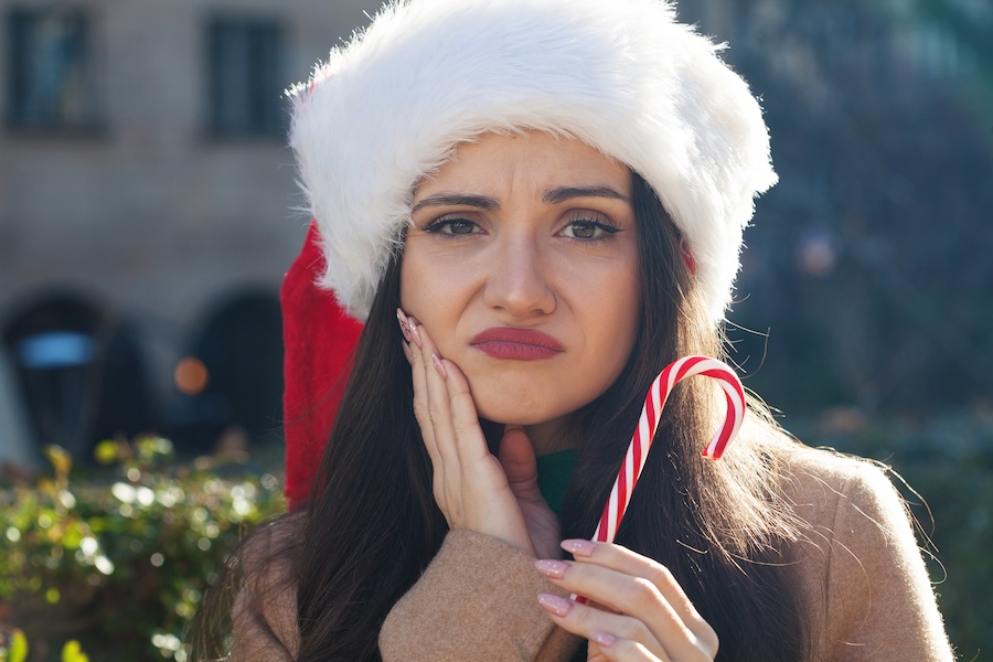 emergency dentistry over the holidays, woman with toothache over the holidays