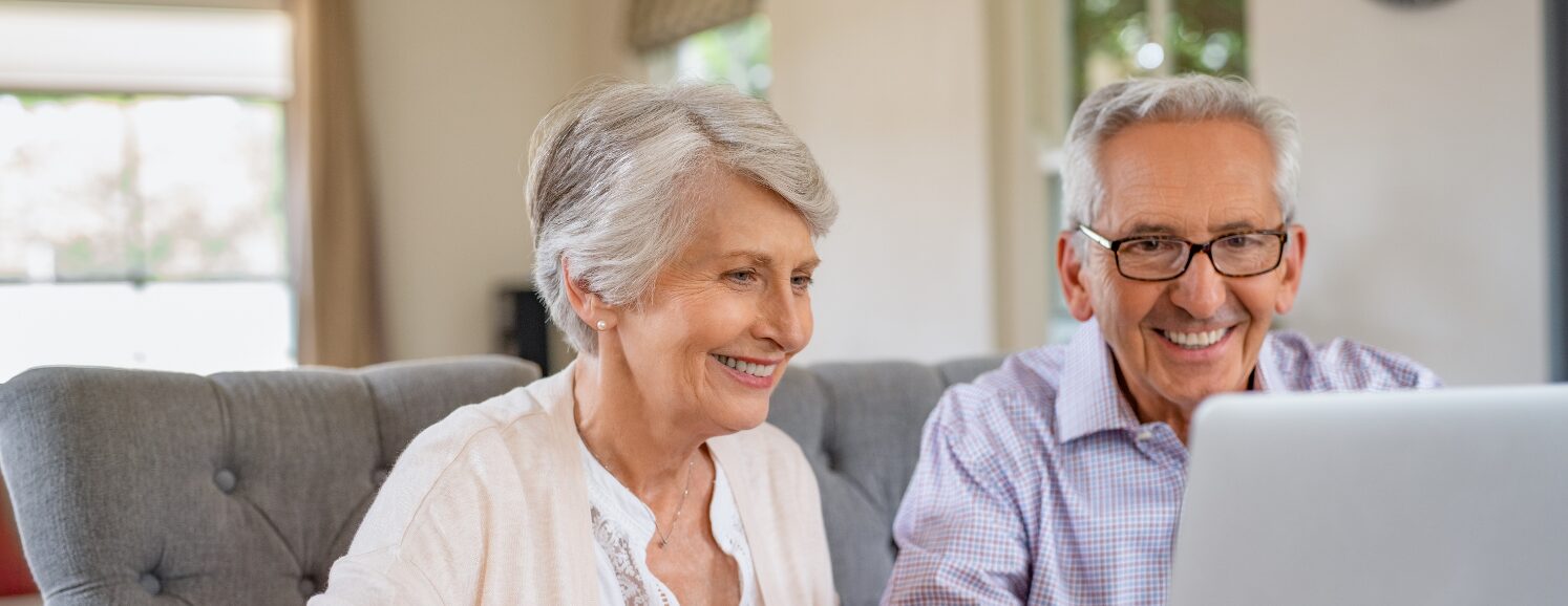 Happy senior couple smiling confidently after dentures at Grafton Dental Care in Grafton MA